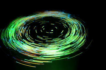 green vortex effect created with fiber optic light source