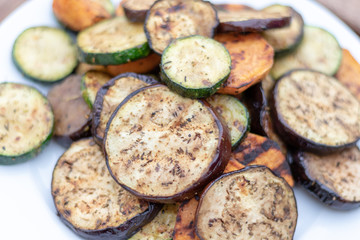Close up of grilled vegetables on a white plate 