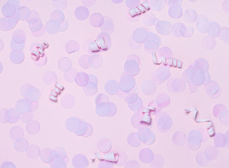 Pink festive confetti background.