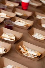 Snacks in paper eco-friendly boxes. Takeout food in a paper box. Fast food on the street