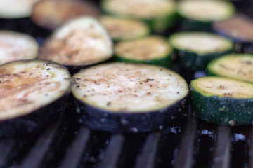 Close up view on aubergine slices in the grill for barbecue