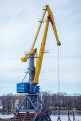 loading cranes in the port against the sky