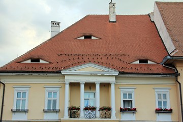 Colorful house in the old center of Sibiu, with traditional roof