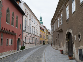 Old buildings line a pedestrian street of the old town in Sopron, Hungary