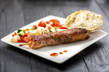 kebab on sticks served with vegetables