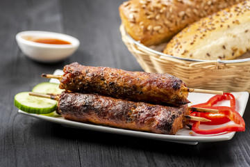 kebab on sticks served with vegetables