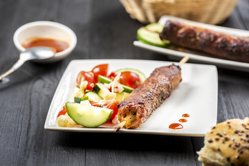 kebab on sticks served with vegetables