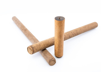 Ebonite sticks on white background. Also is known as hard rubber or vulcanite. Serves as a material for making decoration or other products