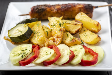 kebab on sticks served with vegetables