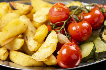 baked potatoes with tomatoes and zucchini