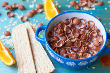 Chocolate flakes with milk. Dietary breakfast.