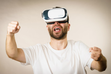 Naklejka premium Adult man wearing vr goggles