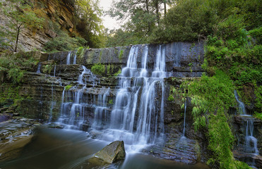 Fototapeta na wymiar Small waterfall near village Ripit i Pruit, Catalonia, Spain
