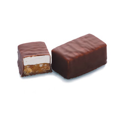 Chocolate bar in a cut on a white background isolate. Isolated chocolate dessert with caramel filling and nougat. Smooth cut of the chocolate.