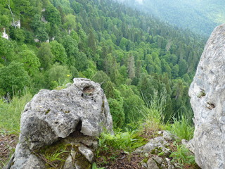 Beautiful dramatic sunset in the mountains. Landscape with sun light shining through orange clouds