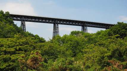 Fototapeta na wymiar The Victorian wrought iron Meldon Viaduct, disused railway line and part of the Granite Way, Dartmoor National Park, Devon, UK