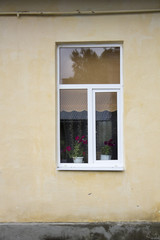 Fototapeta na wymiar Photo of old single window on old wall