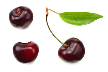 cherry with green leaf isolated on white background