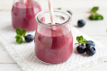 Two jars of blueberry smoothie