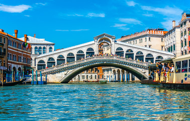 Fototapeta na wymiar Rialto Bridge View from Canal in Venice, Italy