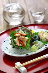 sazae ( horned turban shell ) sashimi, traditional japanese seafood dish