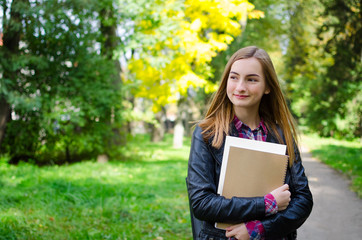Fototapeta premium Teen girl outdoor holding books