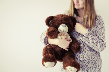 Teen girl with teddy bear