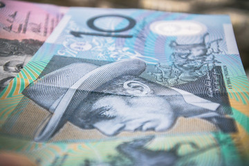 Obraz na płótnie Canvas Stylish bright background, made of Australian banknotes, laid out randomly.