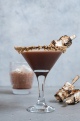 Hot chocolate cocktail with graham crackers and roasted marshmallow