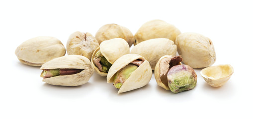 heap of ripe roasted pistachio isolated on white background