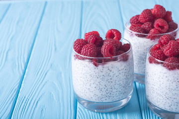 Chia pudding in glass with raspberry