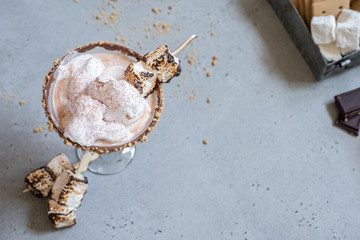 Hot chocolate cocktail with graham crackers and roasted marshmallow