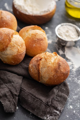 Fresh bread with ingredients on a dark background. Copy space.