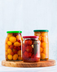 Harvest of red and yellow tomatoes, closed in cans for preservation and fermentation. Autumn...