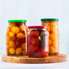 Harvest of red and yellow tomatoes, closed in cans for preservation and fermentation. Autumn...