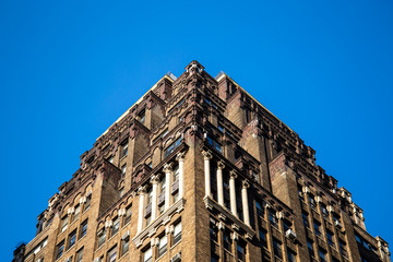 New York City / USA - JUL 13 2018: Symmetry skyscraper looking up view in midtown Manhattan