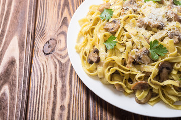 Pasta tagliatelle with chicken meat and mushroom