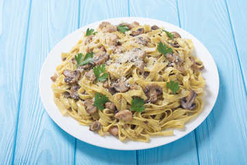 Pasta tagliatelle with chicken meat and mushroom