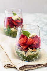 Spinach salad in glass.