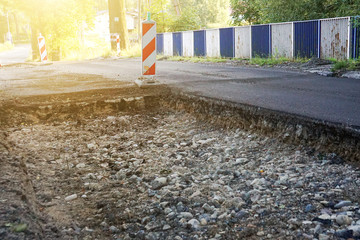 Dismantling of asphalt, repair of the road, large pit on the asphalt