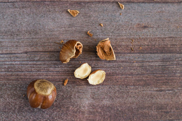 Split and whole nuts in a small plate with different backgrounds.