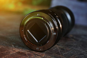 zoom lens. bayonet lens. on a wooden background