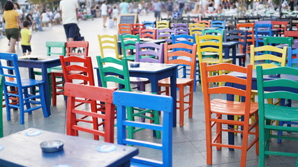 Fototapeta na wymiar colored cafeteria chairs in holiday area