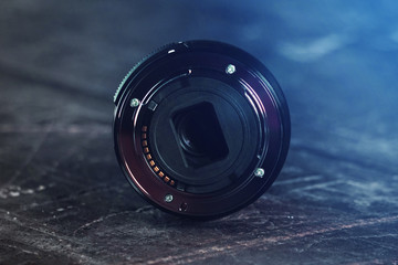 zoom lens. bayonet lens. on a wooden background