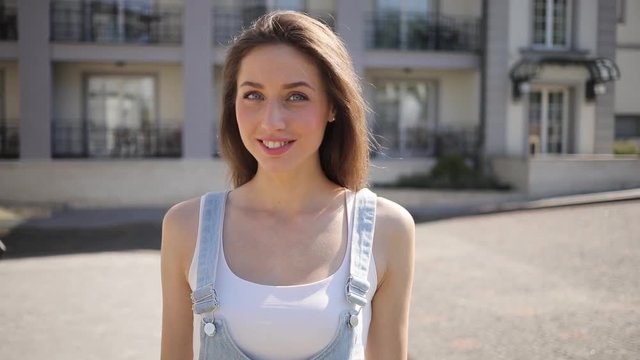 Close up view of pretty blue-eyed woman looking straight to camera and charmingly smiling. Natural beauty, charisma. Positive emotions, cheerful mood, feeling happy. Female portrait