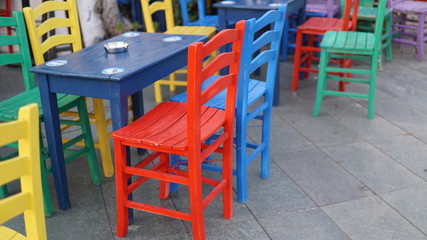 Fototapeta na wymiar colored cafeteria chairs in holiday area