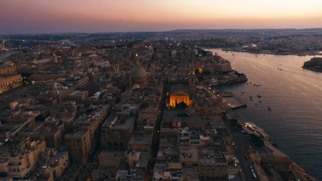 High aerial shot around the Dome of Carmelite Church Valletta