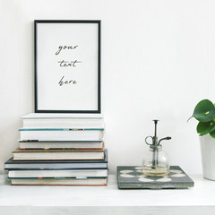 Modern home interior with mock up frame ,plants and vintage sprinkler on the shelf. White wall....
