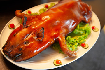 Delicious, Golden Roasted BBQ Suckling pig Cantonese Style made from a piglet that turned into...