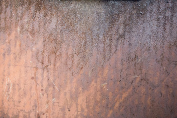 Rusted metal surface with texture and orange colors